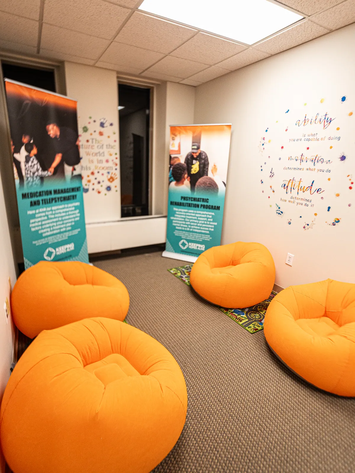 Orange bean bag chairs in the KHA lounge