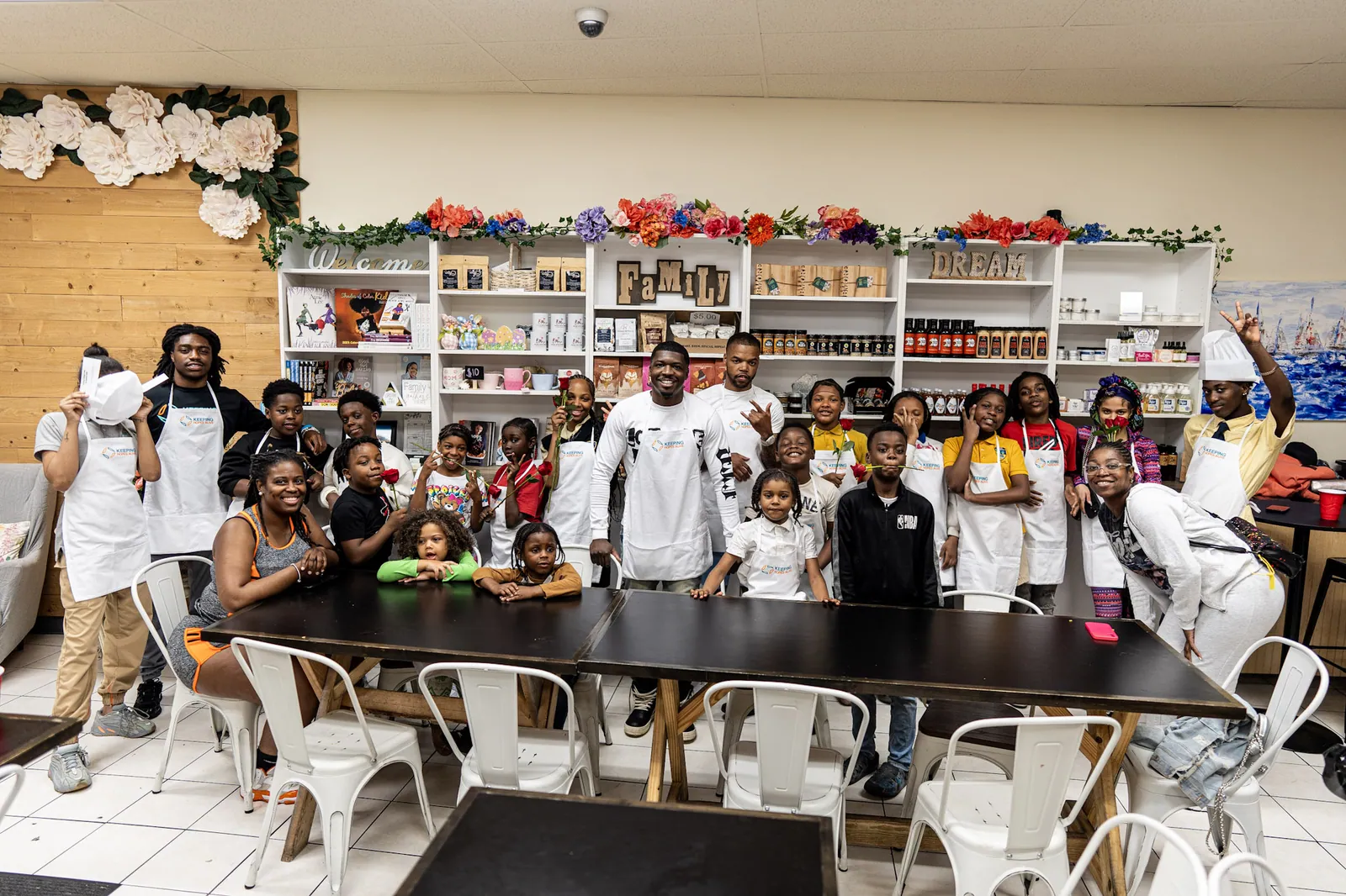 KHA youth and staff in a kitchen after a cooking class