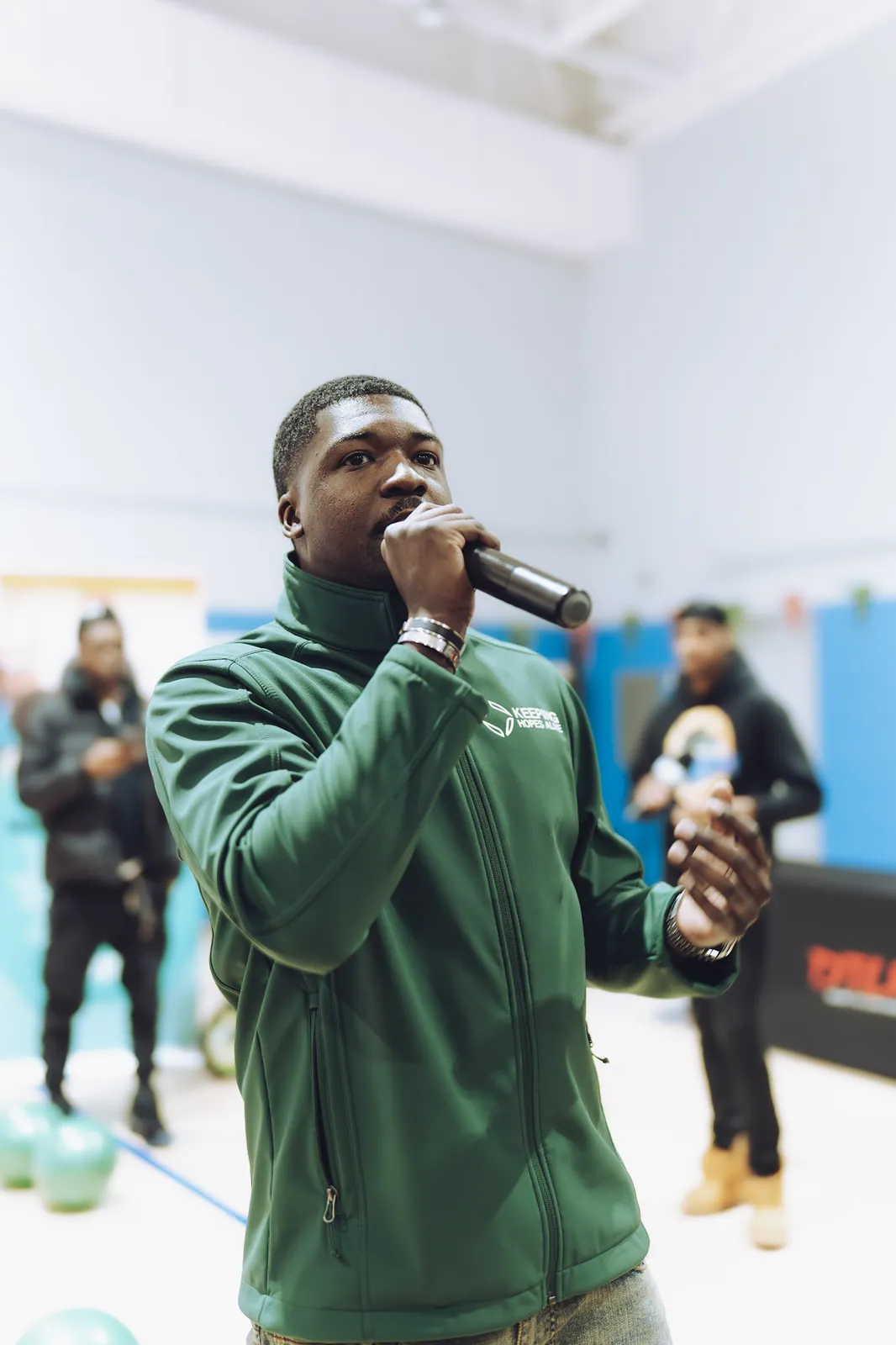 A KHA speaker addressing families at a community event